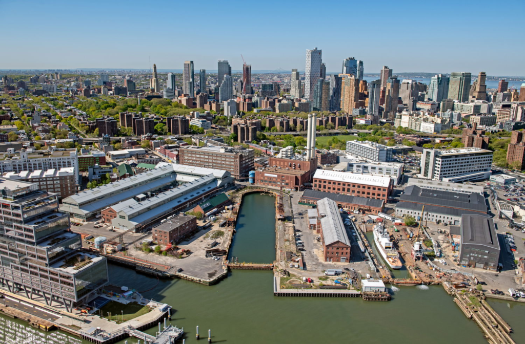 Brooklyn Navy Yard waterfront buildings and central steam plant viewed from the East River